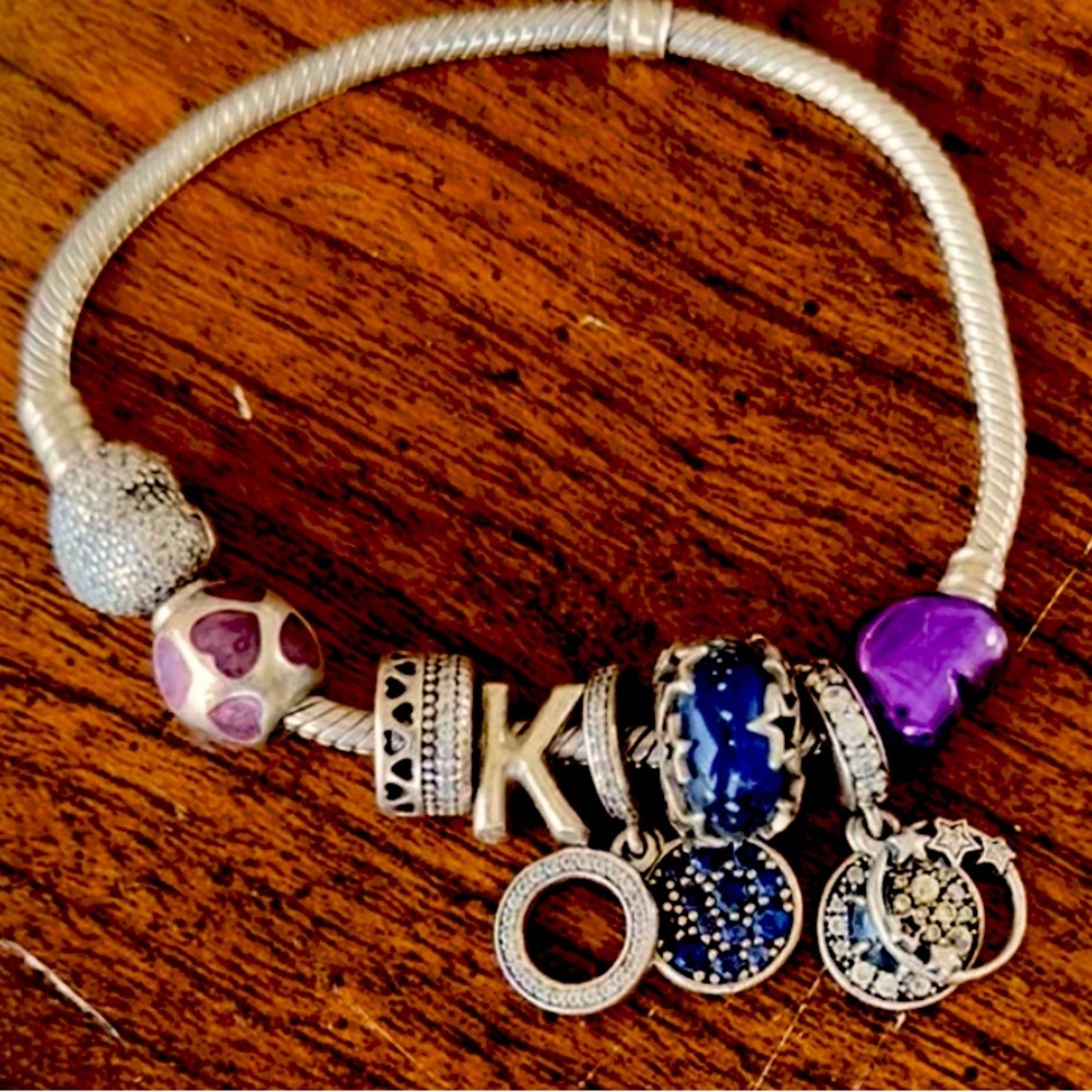 Gently used pandora bracelet. 7 charms included with purchase